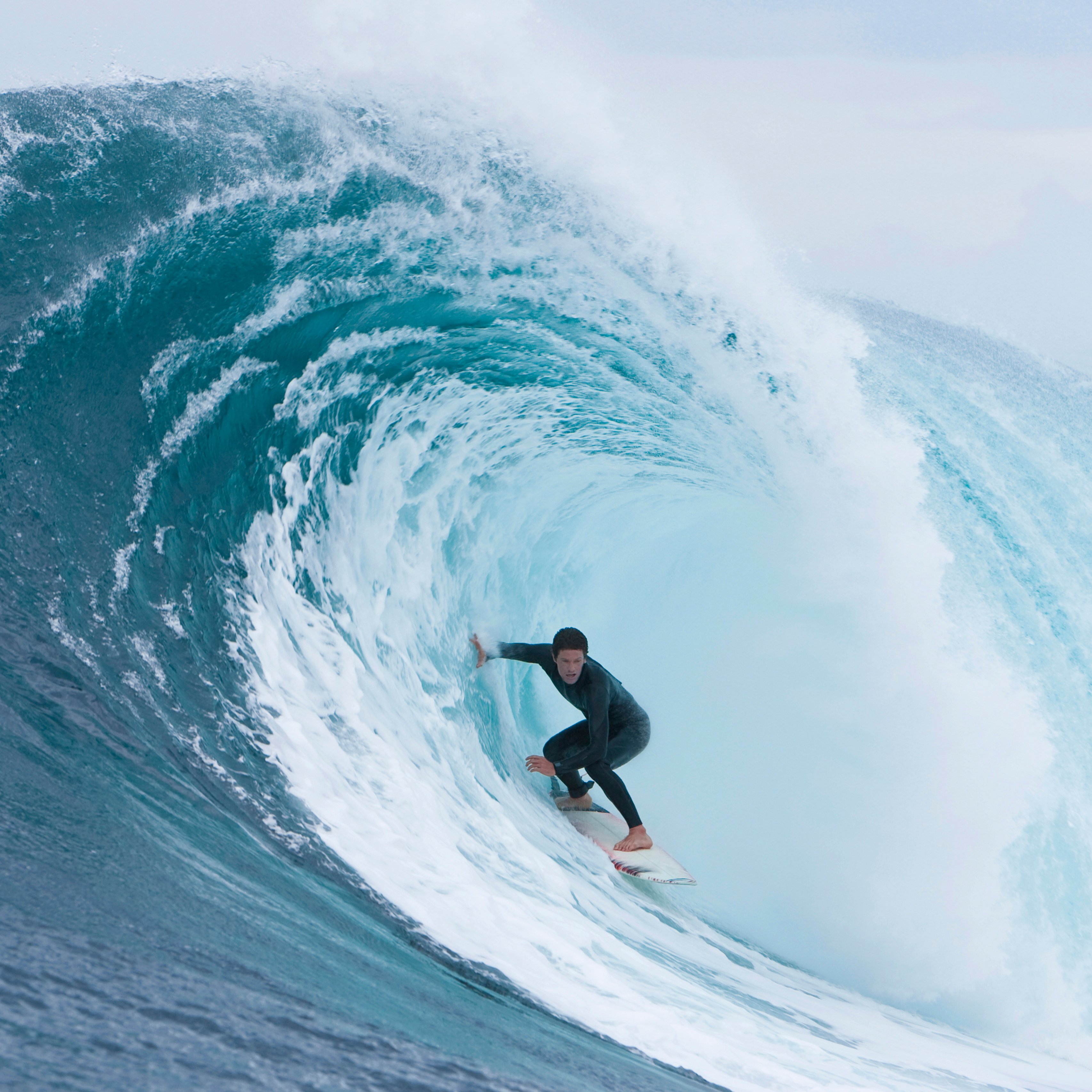 Item 1 Person riding surfboard inside curl of wave