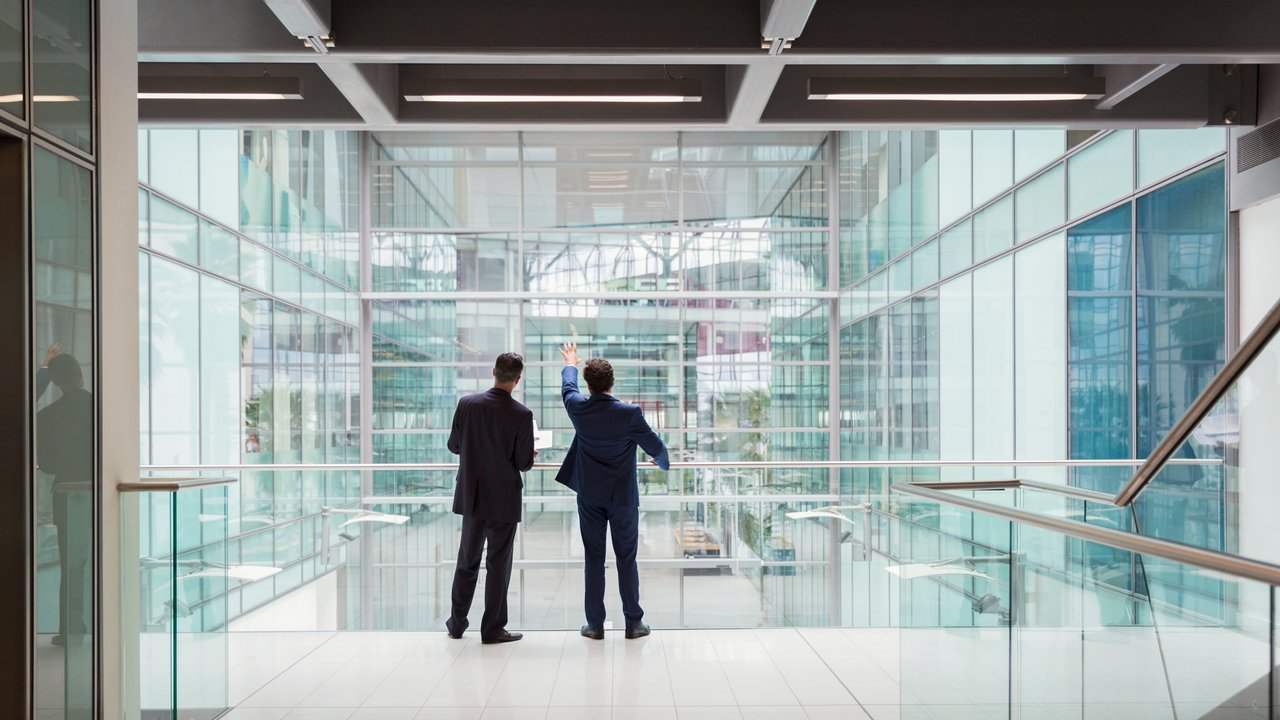 Two colleagues having a discussion in the halls