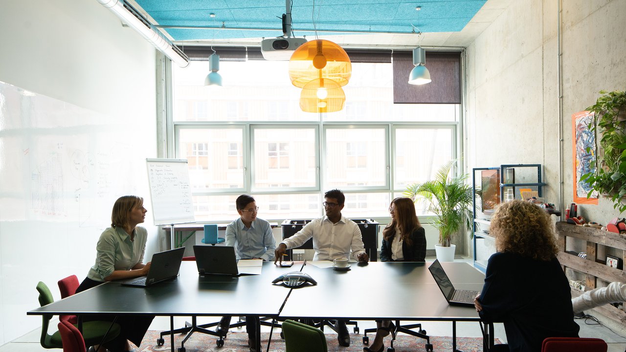 Colleagues collaborating around a table