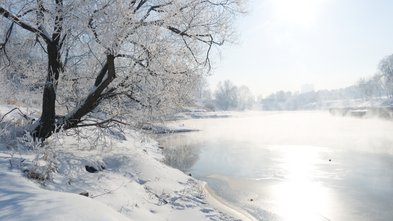 Winter landscape with the river in frosty day